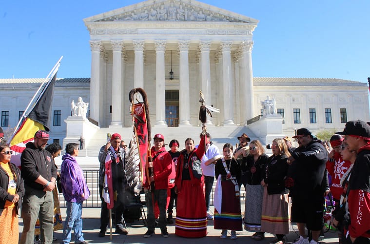 Native Americans hold protest outside the Supreme Court house in their tribal garb