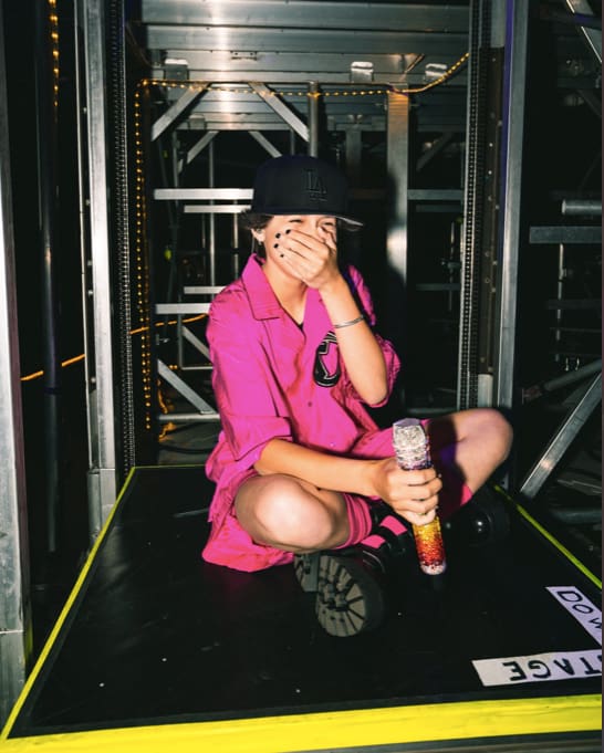 Emme on a stage lift