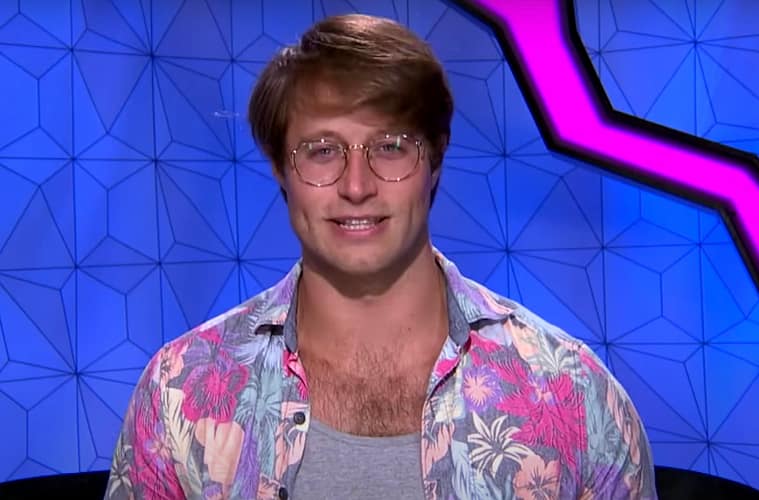 Luke Valentine sitting facing the screen in the Big Brother confession room