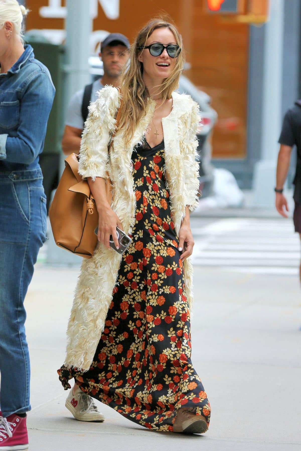 Olivia Wilde wearing a dress paired with sneakers