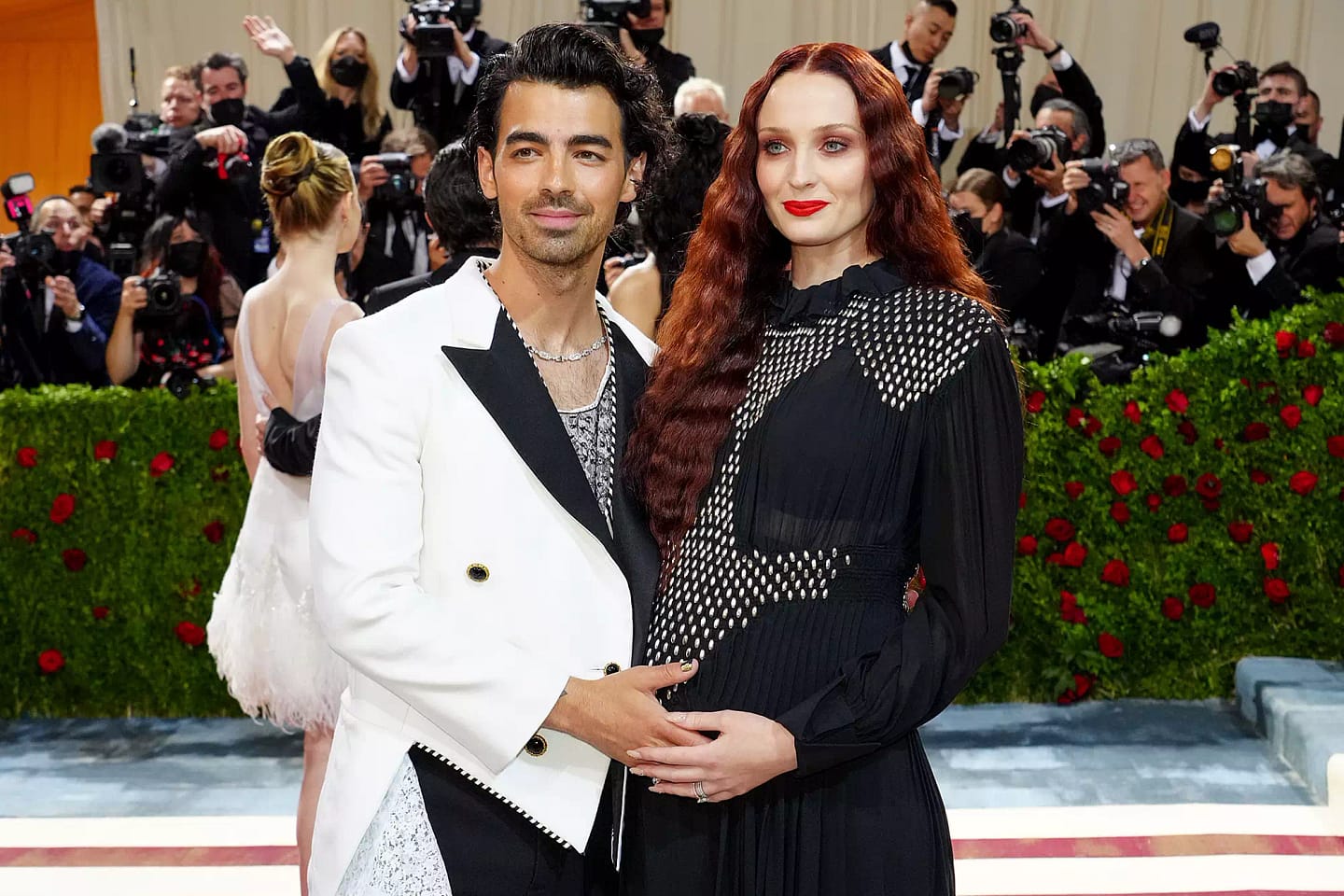 Nick Jonas and Priyanka Chopra with their child.