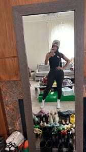 Cardi B wears designer clothes as she completes community service.