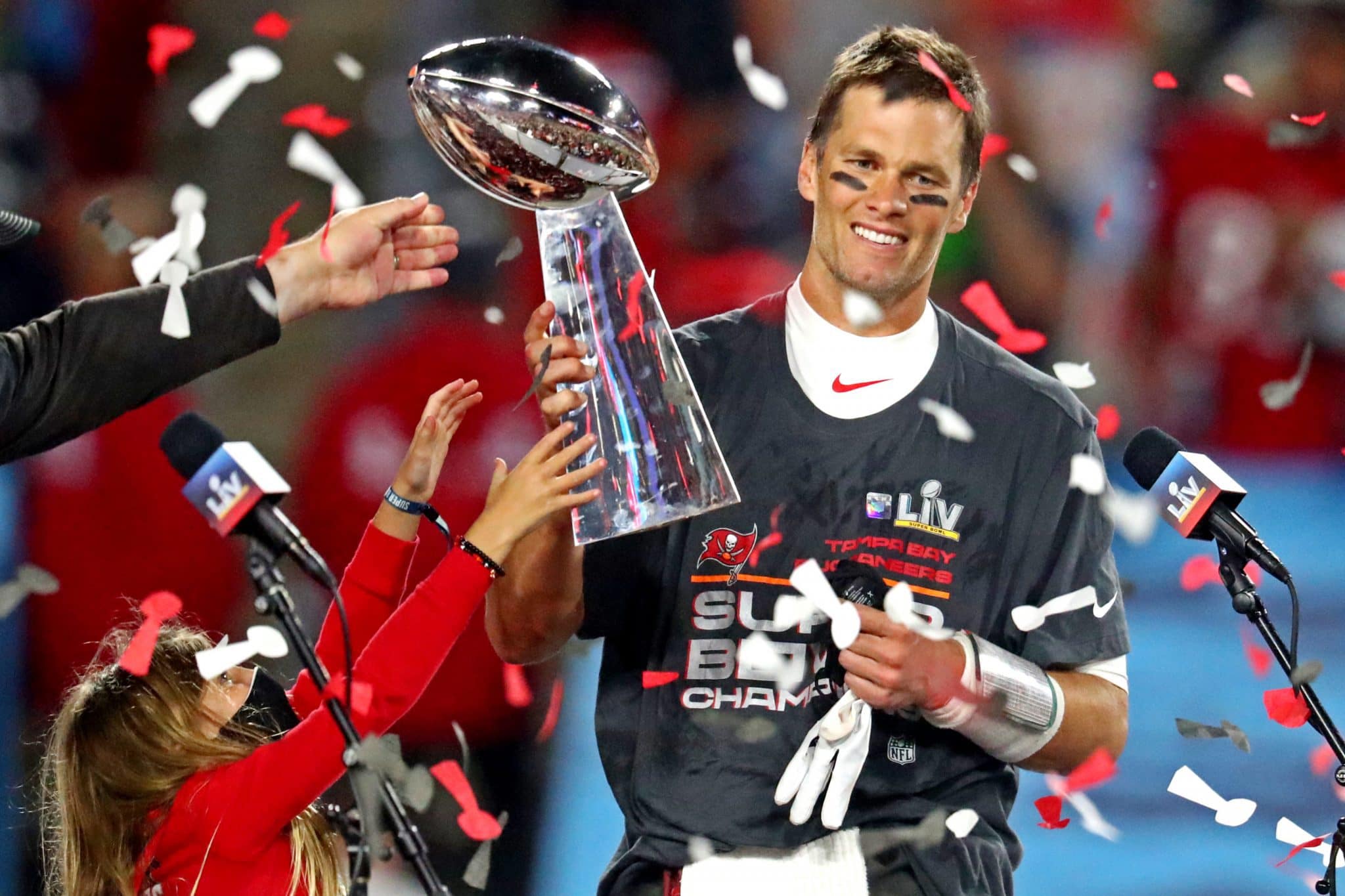 Tom Brady with the Superbowl trophy.