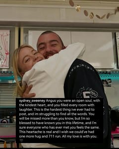 A behind the scenes photo of Sydney Sweeney (left) hugging Angus Cloud (right) both smiling at the camera.