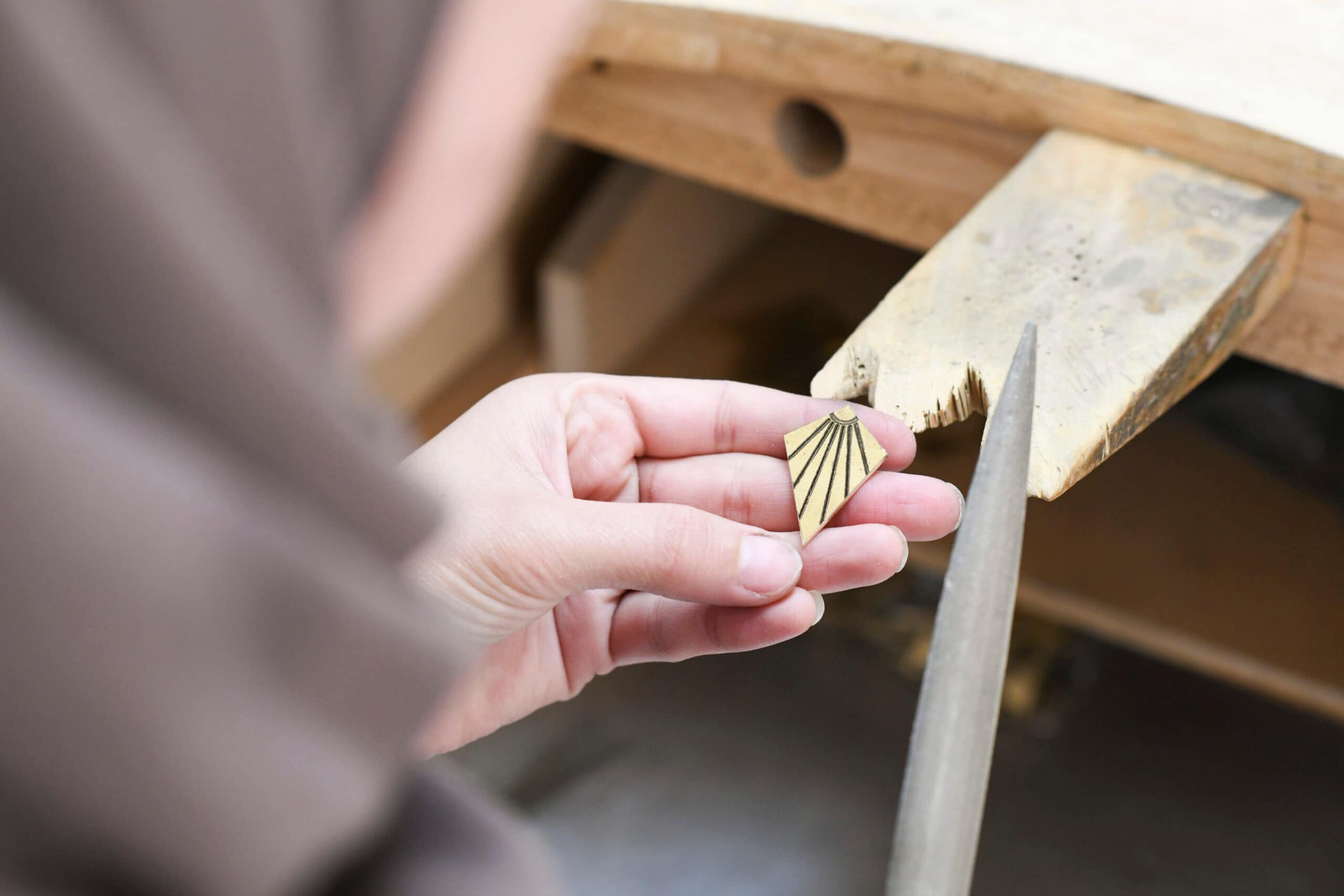 Bronze pin from jenny bird pin point project for world refugee day