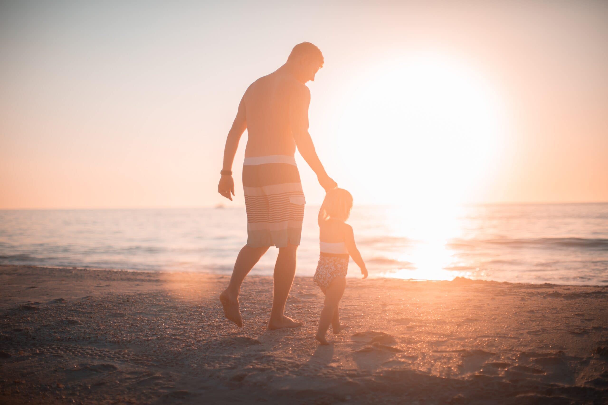 Son and dad on beach