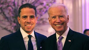 Hunter Biden (left) posing next to Joe Biden (right) at a black tie event.