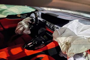 The inside of Pete Davidson's car after the crash. Both airbags are deployed and the passenger side of the windscreen is cracked.