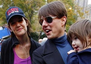 Suri Cruise as a baby with her parents