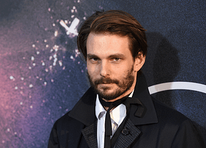 A close up of Sam Levinson posing on the red carpet premiere of 'Euphoria'