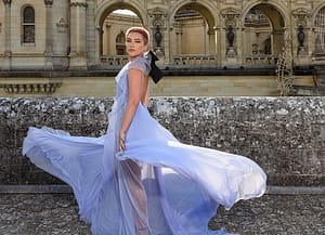 Florence Pugh twirling in a sheer blue gown and buzzed pink hair at the Valentino couture show