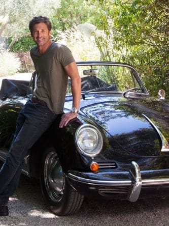 Mcdreamy, aka Patrick Dempsey, poses with his classic high end car