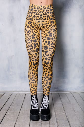 leopard print leggings on a woman wearing black platform boots