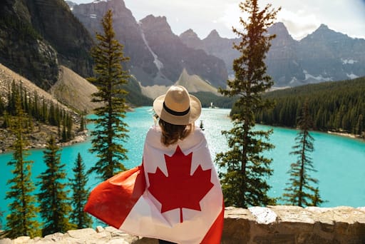 a travel influencer wearing a canadian flag