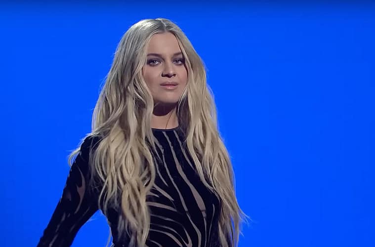 Kelsea Ballerini in zebra-like black jumpsuit