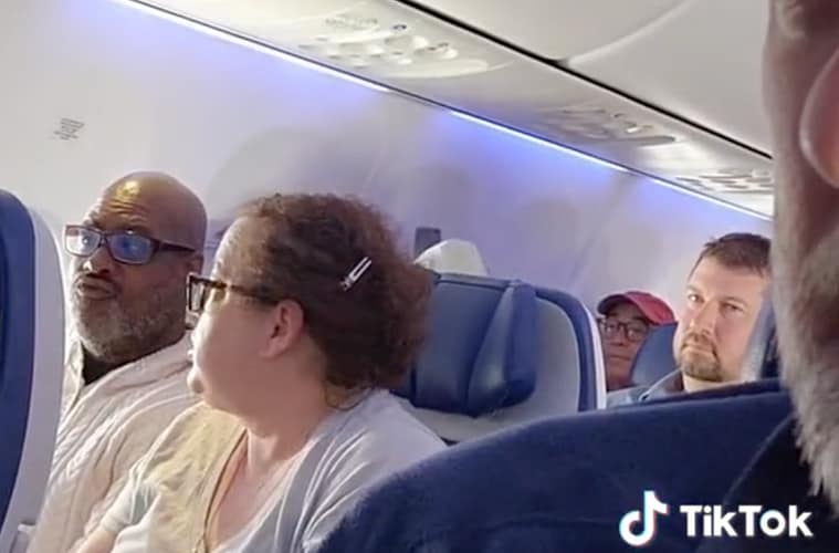 crying baby airplane man having meltdown