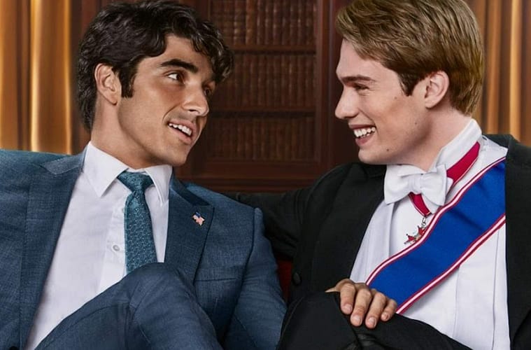 A close up of the official poster for 'Red White and Royal Blue'. The wo characters are sitting on a couch with one leg crossing each other's one has a Union Jack flag sock and the other a U.S flag sock.