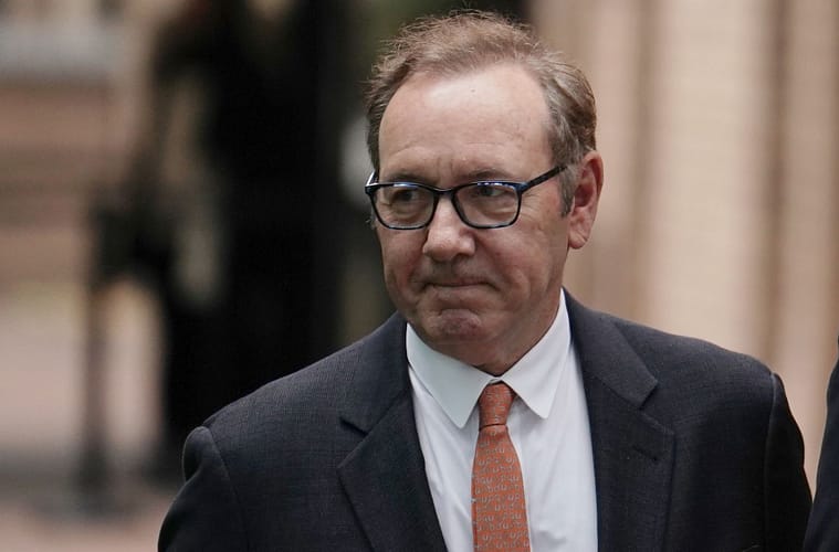 Kevin Spacey walking inside courthouse for sexual assault trial