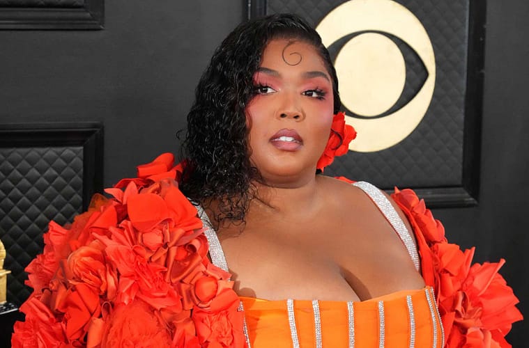 Lizzo posing on the red carpet of the 65th GRAMMY Awards