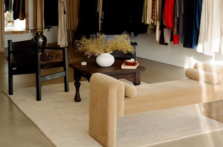 image of vintage store with clothing racks and a seating area