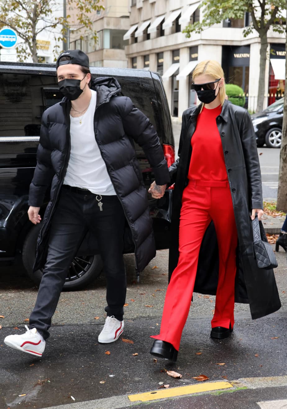 Peltz wears a red set with a black trench