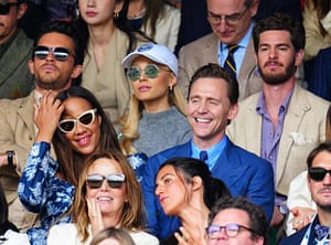 Sitting together in the audience at Wimbledon in top row from left to right is, Jonathan Bailey Ariana Grande and Andrew Garfield. In the row in front of them, from left to right, are Zawe Ashton and Tom Hiddleston.