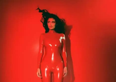 Kylie Jenner Channels Britney Spears in Red Latex Catsuit for Kylie Cosmetics