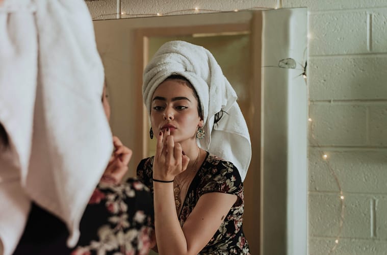 a young woman doing a beauty skincare routine for fresh healthy glowing natural skin