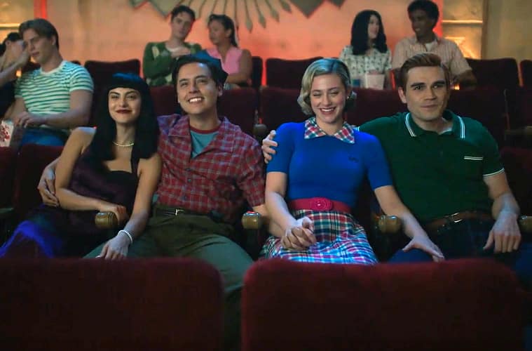 (from left to right)Veronica, Jughead, Betty and Archie sitting next to each other in a movie theater