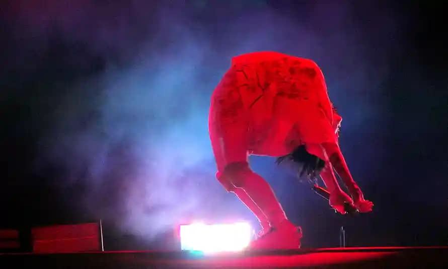 Billie Eilish leaning back.
